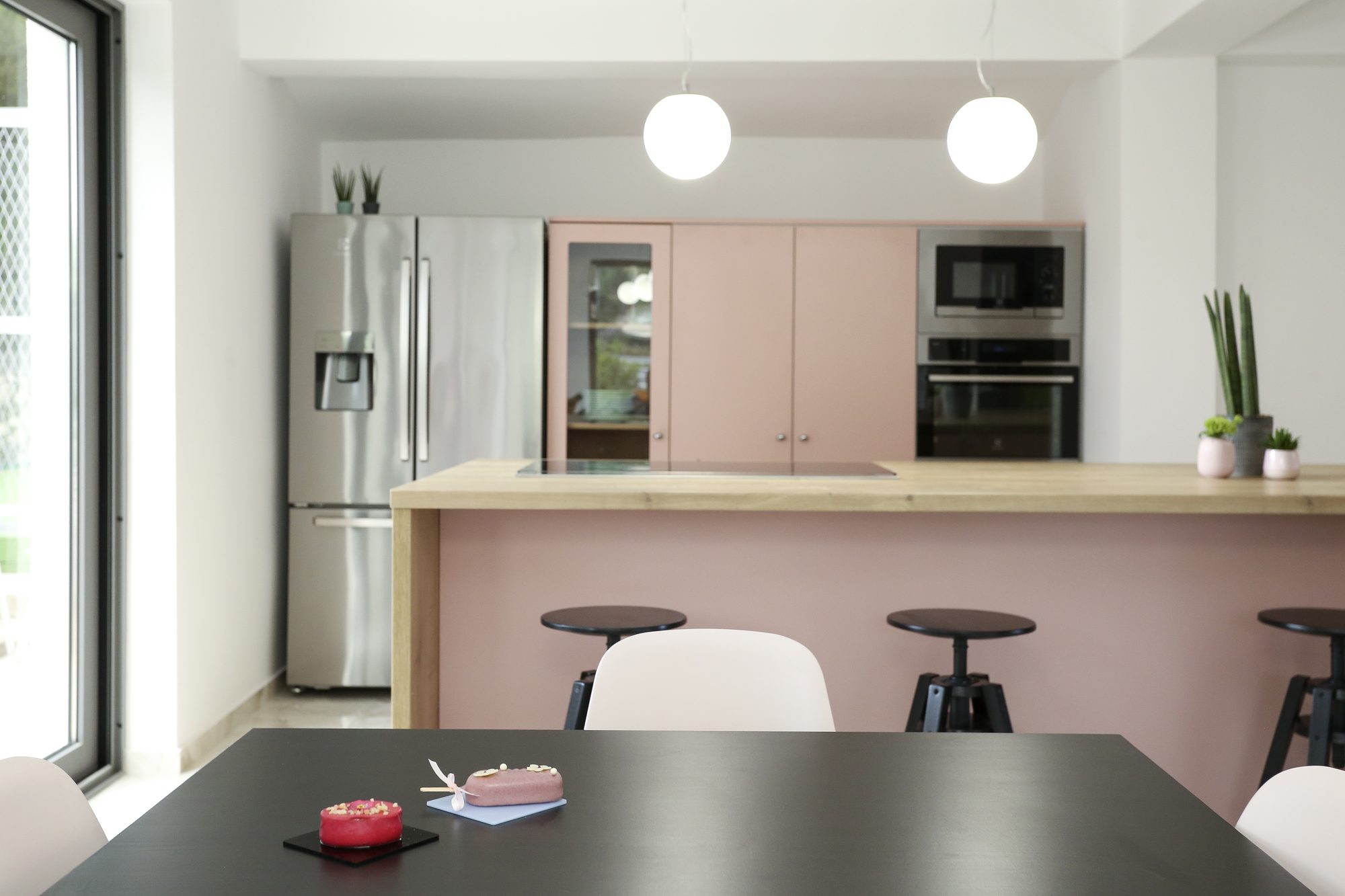 Modern kitchen with island and bar stools in the large family villa in Dalmatia