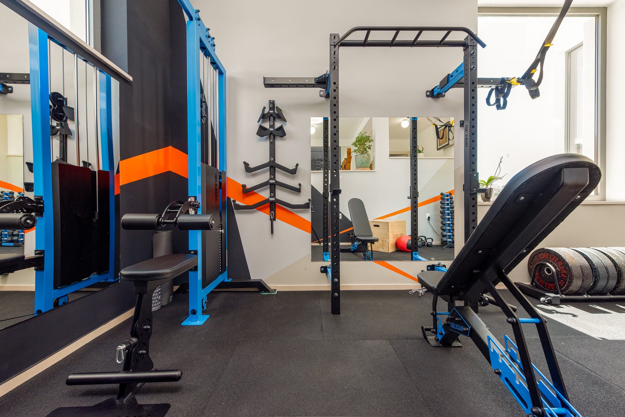 Indoor fitness room with weights and training equipment in the Dalmatian villa